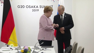 Путин помог растерявшейся Меркель