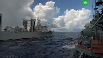 Военные моряки РФ и КНР отработали передачу грузов на ходу
